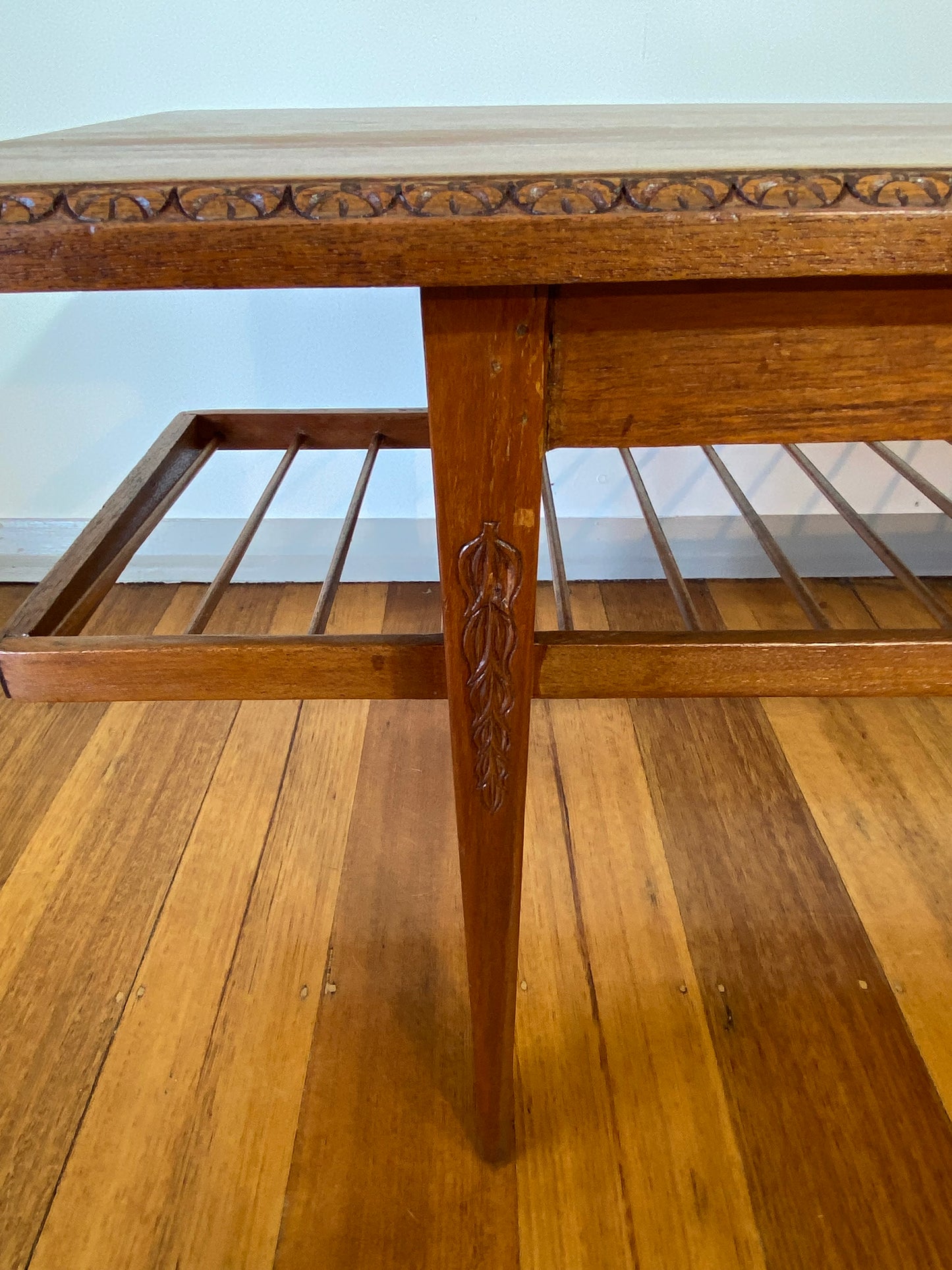 Vintage teak coffee table with magazine rack and carved details