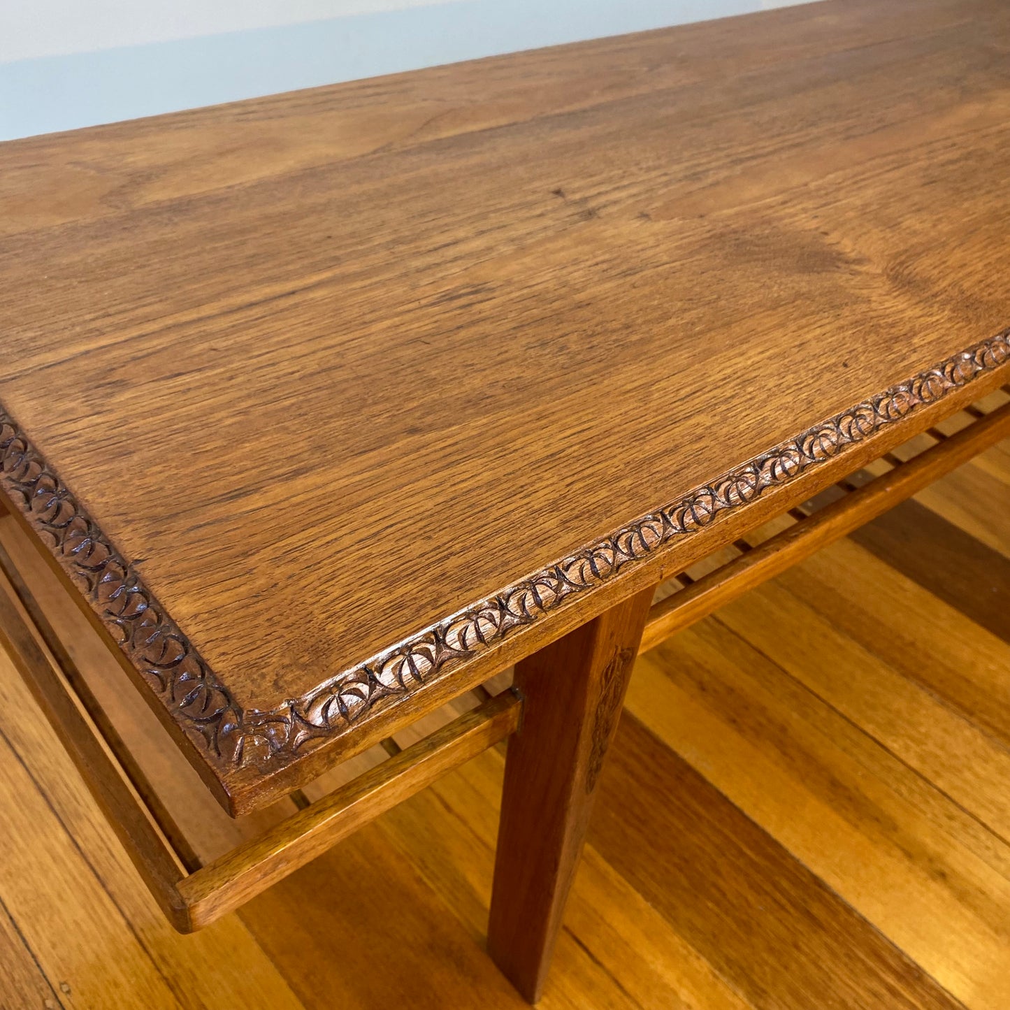 Vintage teak coffee table with magazine rack and carved details