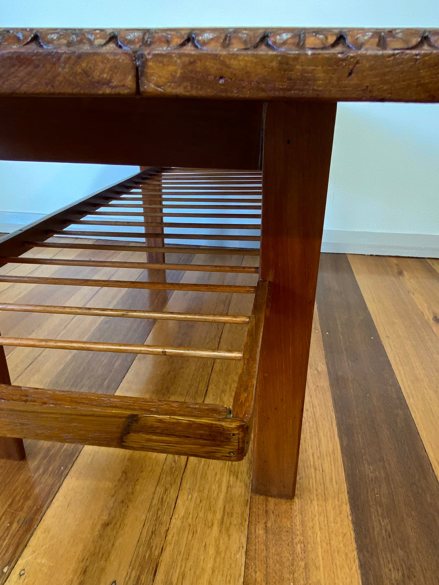 Vintage teak coffee table with magazine rack and carved details