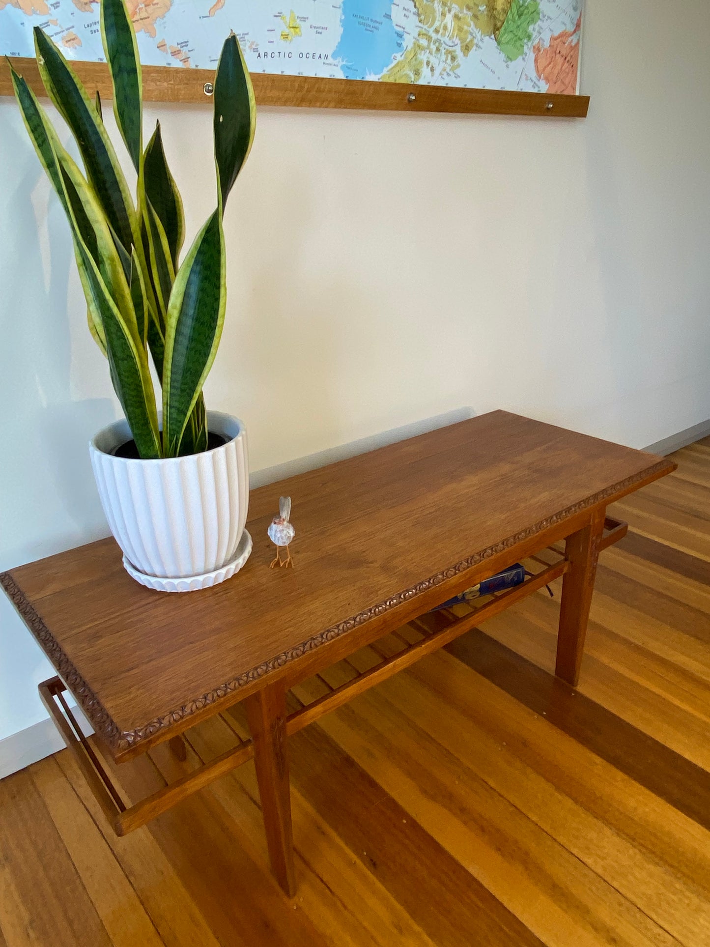 Vintage teak coffee table with magazine rack and carved details