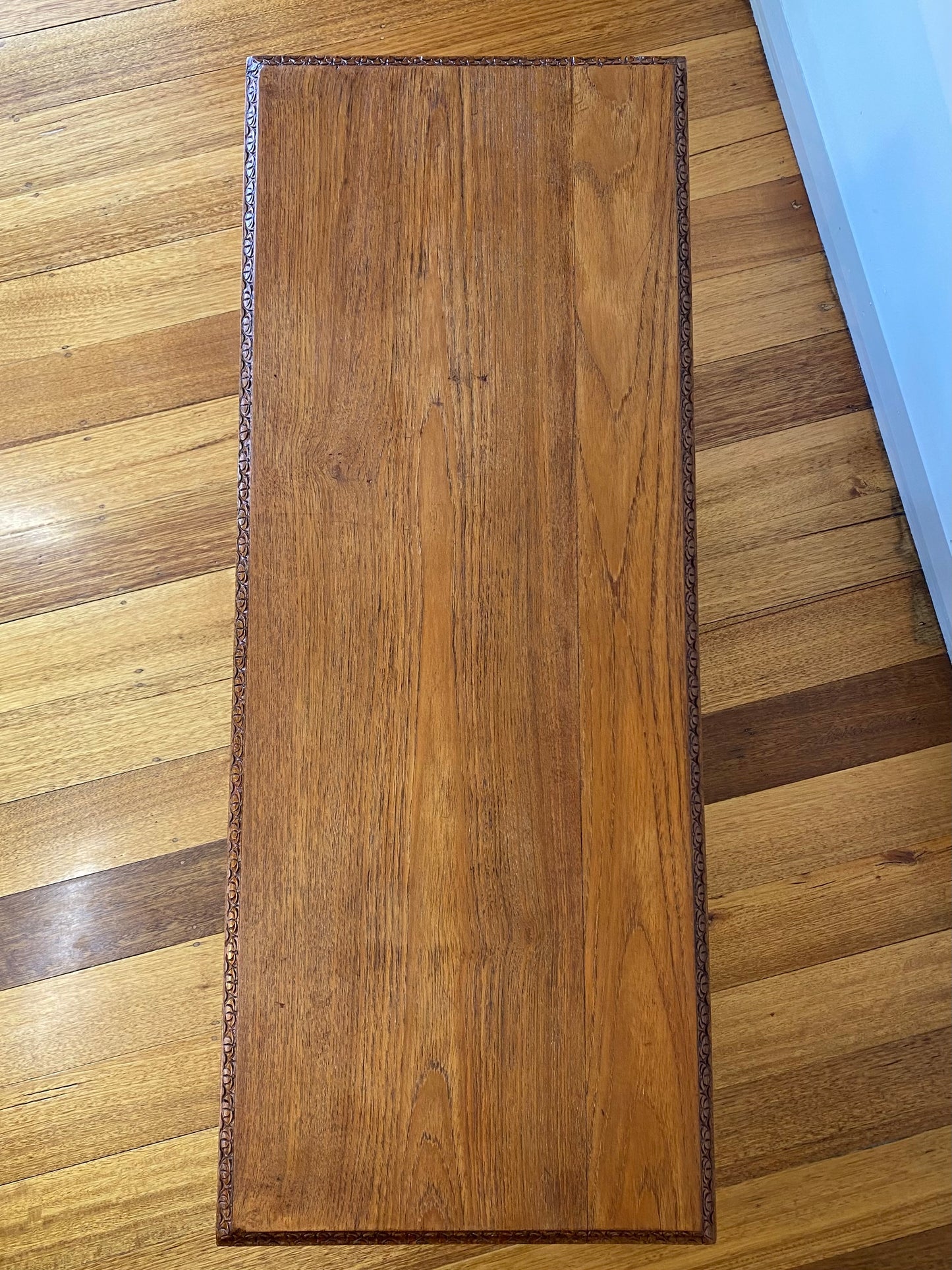 Vintage teak coffee table with magazine rack and carved details