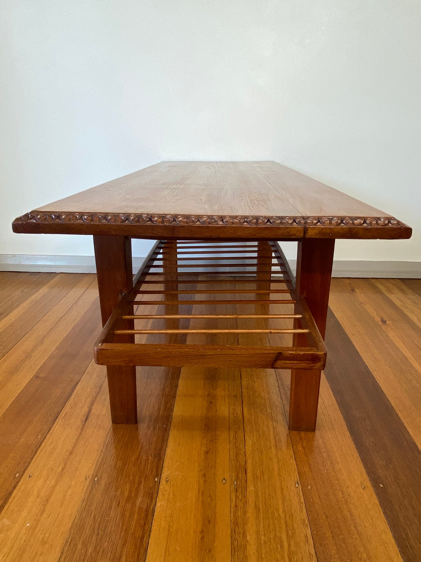 Vintage teak coffee table with magazine rack and carved details