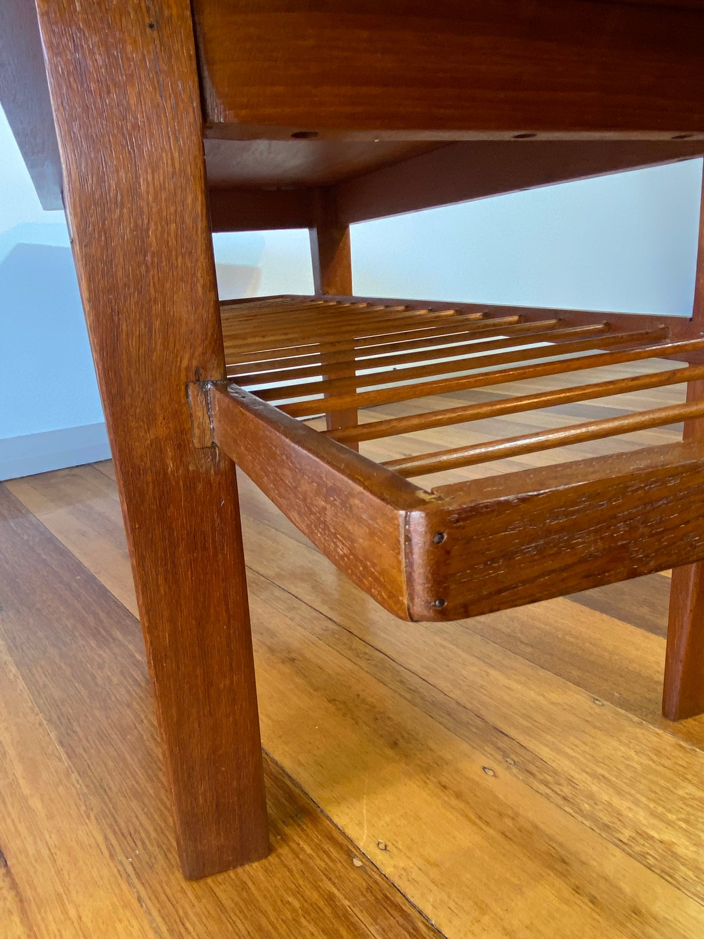 Vintage teak coffee table with magazine rack and carved details