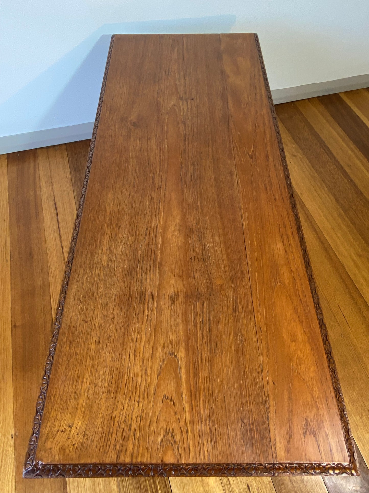 Vintage teak coffee table with magazine rack and carved details