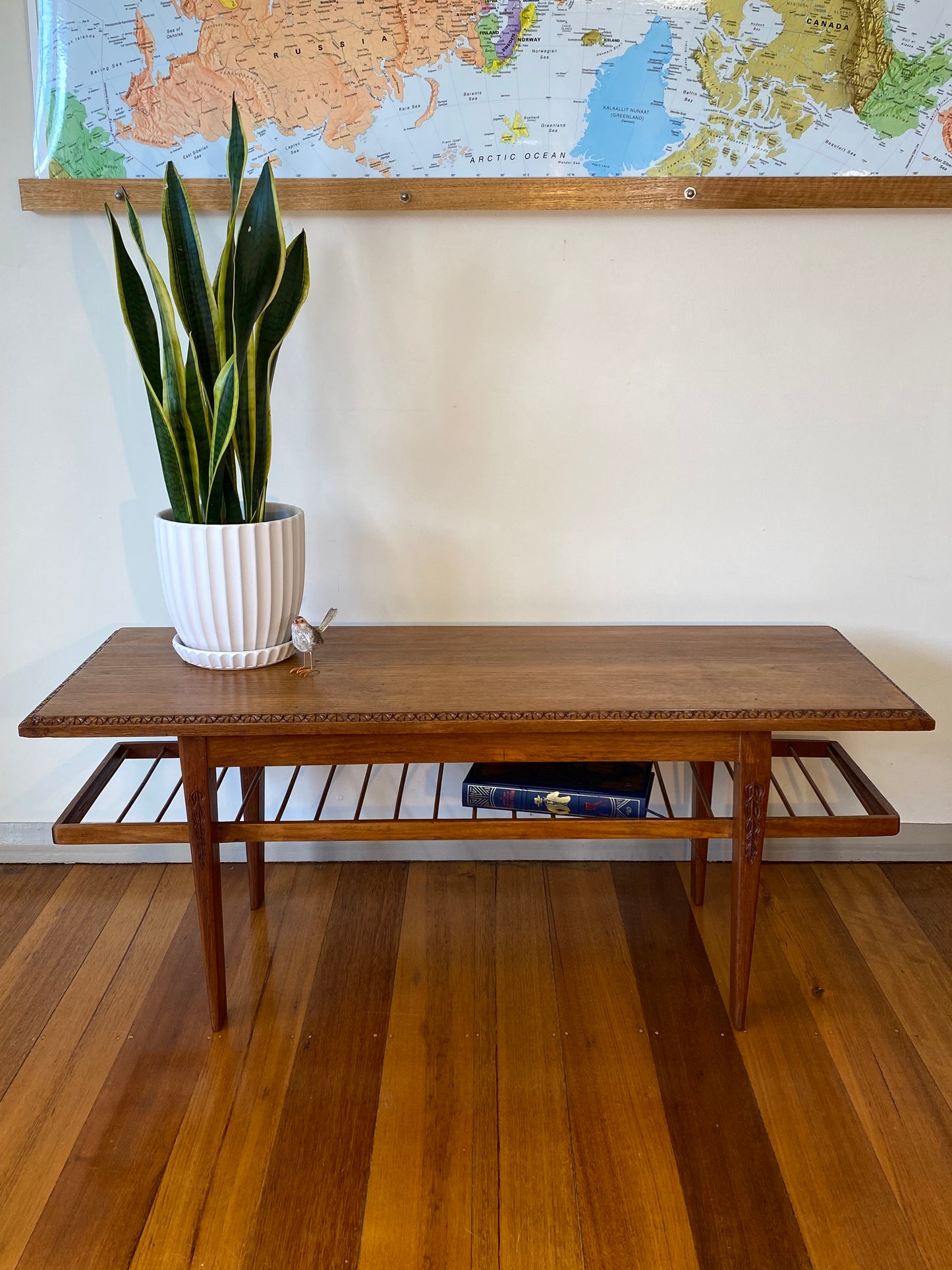 Vintage teak coffee table with magazine rack and carved details