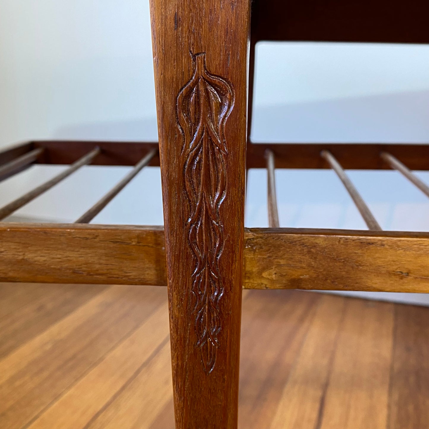 Vintage teak coffee table with magazine rack and carved details